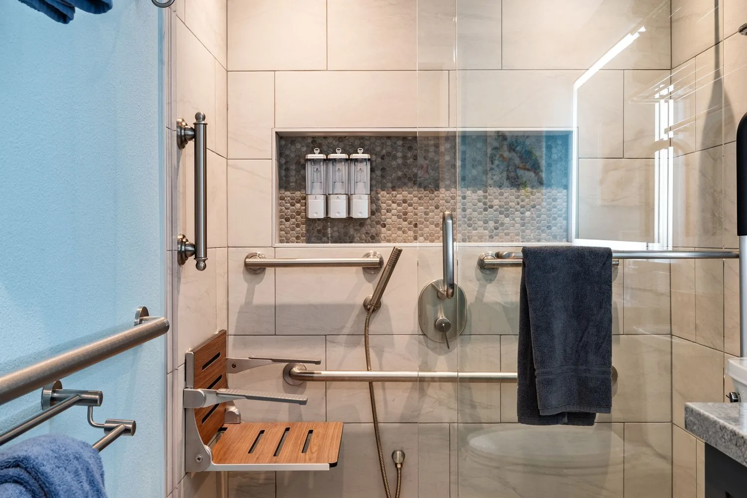Walk-in shower with teak seat